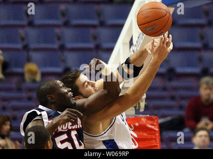 Saint Louis University Billikens Ian Vouyoukas (R) battles Duquesne Dukes Almamy Thiero for the rebound during the first half at the Scottrade Center in St. Louis on January 6, 2007. (UPI Photo/Bill Greenblatt) Stock Photo