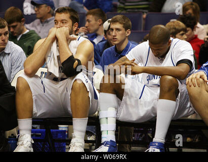 Saint Louis University Billikens Ian Vouyoukas (L) and Justin Johnson can't bear to watch the last minute of play as they lose the game, 73-63 to  the Duquesne Dukes at the Scottrade Center in St. Louis on January 6, 2007.  (UPI Photo/Bill Greenblatt) Stock Photo