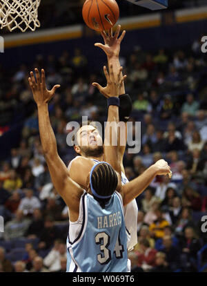 Saint Louis University Billikens Ian Vouyoukas goes up and over Rhode Island Rams Darrell Harris for two points in the first half at the Scottrade Center in St. Louis on January 10, 2007.   (UPI Photo/Bill Greenblatt) Stock Photo