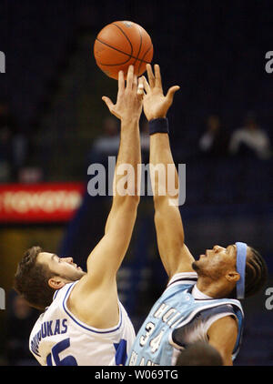 Rhode Island Rams Darrell Harris (R) and  Saint Louis University Billikens Ian Vouyoukas jump for the basketball during the tip off in the first half at the Scottrade Center in St. Louis on January 10, 2007.   (UPI Photo/Bill Greenblatt) Stock Photo