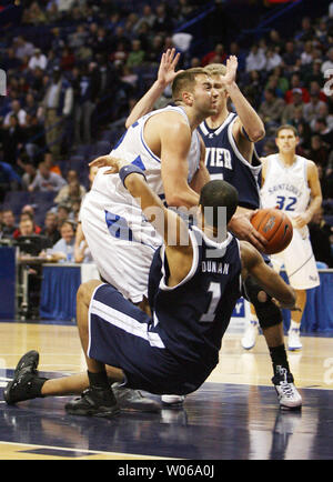 Saint Louis University Billikens Ian Vouyoukas (15) proves to be too much for the Xavier Musketeers Josh Duncan (1) and Justin Doellman in the first half at the Scottrade Center in St. Louis on January 13, 2007. (UPI Photo/Bill Greenblatt) Stock Photo