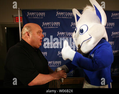 Former Utah head basketball coach and ESPN college basketball analyst Rick Majerus is greeted by the Saint Louis University mascot, the Billiken, after being introduced as the new head basketball coach at the school in St. Louis on April 30, 2007.   (UPI Photo/Bill Greenblatt) Stock Photo