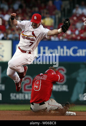 Los Angeles Angels' Chone Figgins, right, slides safely into third base ...