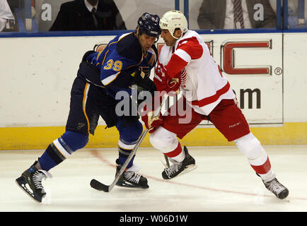 St. Louis Blues Doug Weight (L) goes head to head with Detroit Red Wings Chris Chelios during the  first period at the Scottrade Center in St. Louis on November 13, 2007.    (UPI Photo/Bill Greenblatt) Stock Photo