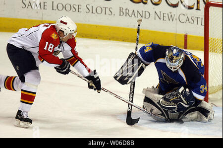 Florida Panthers Ville Peltonen of Finland tries to push the puck past St. Louis Blues goaltender Manny Legace in the first period at the Scottrade Center in St. Louis on December 13, 2007. (UPI Photo/Bill Greenblatt) Stock Photo