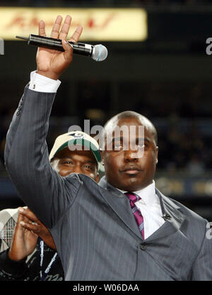 St. Louis Rams Marshall Faulk watches the action from the sidelines,  sitting out the game against the San Francisco 49er's at the Edward Jones  Dome in St. Louis on December 5, 2004.