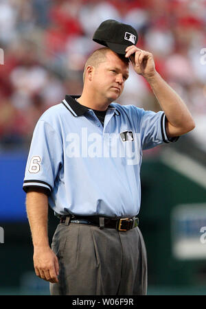 Third base umpire Ron Kulpa adjusts his cap during a game between the Kansas City Royals and the St. Louis Cardinals at Busch Stadium in St. Louis on June 17, 2008. Kulpa is a St. Lousian and continues to live in the area. (UPI Photo/Bill Greenblatt) Stock Photo