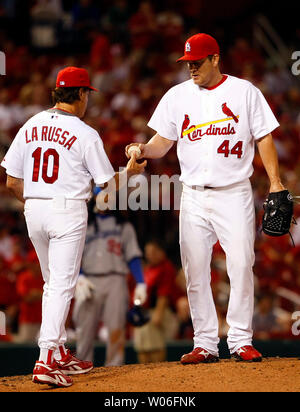St. Louis Cardinals Jason Isringhausen (R) is congratulated by catcher Yadier  Molina after shutting down the Cincinnati Reds in the ninth inning for the  9-2 win at Busch Stadium in St. Louis