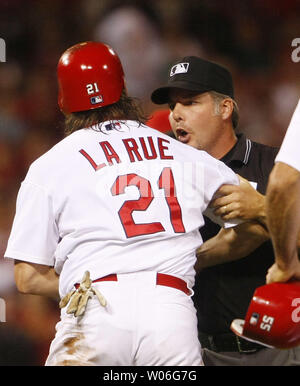 Major League umpire Tim Timmons pushes St. Louis Cardinals Jason La Rue away from Cincinnati Reds Jerry Hairston after the two had words in the eighth inning at Busch Stadium in St. Louis on September 27, 2008. Hairston claimed La Rue went out of his way to slide into him at second base during a play.   (UPI Photo/Bill Greenblatt) Stock Photo