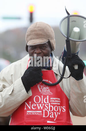 Former St. Louis Cardinals and Baseball Hall of Fame member Lou Brock uses a bullhorn to hawk newspapers at a busy intersection during Old Newsboys Day in Clayton, Missouri on November 20, 2008. The annual event brings out hundreds of volunteers to sell newspapers that benefit children's charities. (UPI Photo/Bill Greenblatt) Stock Photo