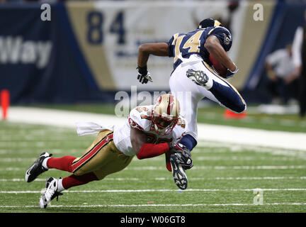 San Francisco 49ers Walt Harris (27) grins as he comes up with an