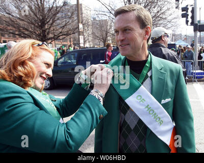 St. Louis Rams General Manager Billy Devanney has his honorary guest sash pinned on by Mary Alice Robin before the start of the St. Patrick's Day Parade in St. Louis on March 14, 2009. (UPI Photo/Bill Greenblatt) Stock Photo