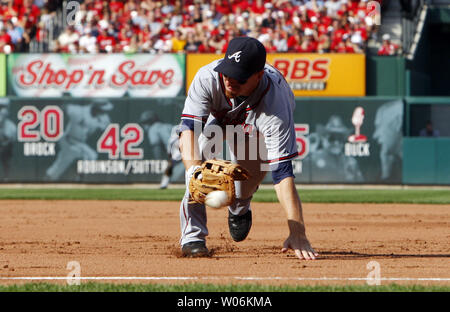 Atlanta Braves first baseman Adam LaRoche can't get to a ball hit down the line by St. Louis Cardinals Joe Thurston in the fourth inning at Busch Stadium in St. Louis on September 12, 2009. The hit resulted in a RBI double. UPI/Bill Greenblatt Stock Photo