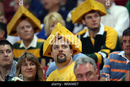 Green Bay Packers fans, wearing their cheeseheads, packed the