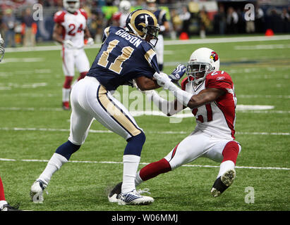 St. Louis Rams Brandon Gibson is pulled out of bounds by Arizona Cardinals Michael Adams after a reception in the fourth quarter at the Edward Jones Dome in St. Louis on November 22, 2009. Arizona won the game 21-13.   UPI/Bill Greenblatt Stock Photo