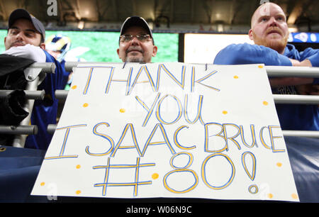 Former St. Louis Rams Isaac Bruce holds the Super Bowl trophy