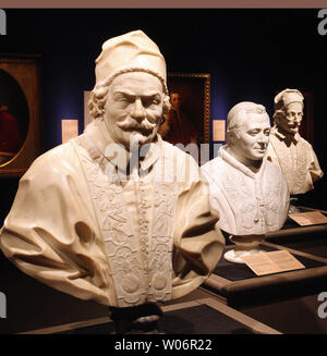 The busts of (L to R) Pope Alexander VIII (1689-1691), Pope Pius IX (1846-1878) and Pope Innocent XI (1676-1689) stand as final preparations are made for the opening of 'Vatican Splendors,' at the Missouri History Museum in St. Louis on May 14, 2010. The busts are part of the 200 rare works of art and historically significant objects from the Vatican. St. Louis is one of only three U.S. cities to host this display which begins on May 15. UPI/Bill Greenblatt Stock Photo