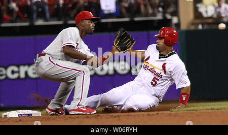 Philadelphia Phillies short stop Jimmy Rollins leaps into the air after  forcing Atlanta Braves runner Kelly Johnson at second base and completes  the double play in the seventh inning at Turner Field