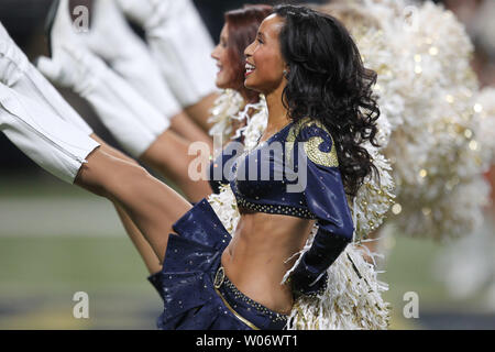 St. Louis Rams cheerleaders wearing camoulflage uniforms, entertain the  crowd during a game against the Denver