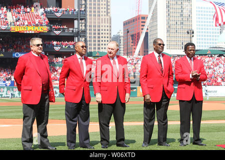 members of the St. Louis Cardinals stand for the National Anthem