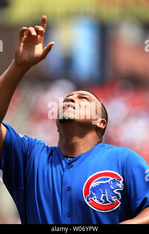 Chicago Cubs' Carlos Zambrano points to the sky as he crosses home plate  after hitting a home run during the fourth inning of a baseball game  against the Cincinnati Reds, Friday, April