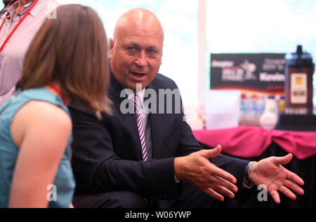 National Baseball Hall of Fame member Cal Ripken talks with friends before presenting the 'Keep Going' award at the Energizer Company in Town and Country, Missouri on June 21, 2011. The Energizer 'Keep Going' award is given to those that show spirit, determination and the drive to make a positive impact on the world. UPI/Bill Greenblatt Stock Photo