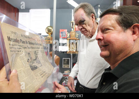 Greg Maracek president of the St. Louis Sports Hall of Fame (R) and former St. Louis Hawks star Ed Mccauley look at old newspapers from the new St. Louis Hawks display at the Scottrade Center in St. Louis on August 18, 2011. Macauley played in the NBA with the St. Louis Bombers, Boston Celtics, and St. Louis Hawks and was named MVP of the first NBA All-Star Game. Macauley scored 11,234 points in ten NBA seasons and was inducted into the Naismith Memorial Basketball Hall of Fame in 1960. Mccauley was a member of the 1958 St. Louis Hawks Championship team. The Hawks display joins the other displ Stock Photo