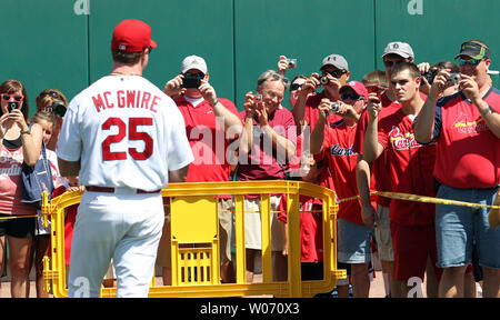 St. Louis Cardinals hitting coach Mark McGwire stops for fans to take photographs during Camera Day at Busch Stadium before a game against the Pittsburgh Pirates in St. Louis on August 27, 2011.   UPI/Bill Greenblatt Stock Photo