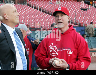 St. Louis Cardinals hitting coach Mark McGwire shares a laugh with Baseball Hall of Fame member Cal Ripken Jr. before Game 4 of the NLCS between the Milwaukee Brewers and the St. Louis Cardinals at Busch Stadium in St. Louis on October 13, 2011.   UPI/Bill Greenblatt Stock Photo