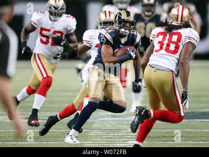 St. Louis Rams Brandon Gibson tries to elude the San Francisco 49er's defense in the fourth quarter at the Edward Jones Dome in St. Louis on January 1, 2012. San Francisco won the game 34-27.   UPI/Bill Grenblatt Stock Photo