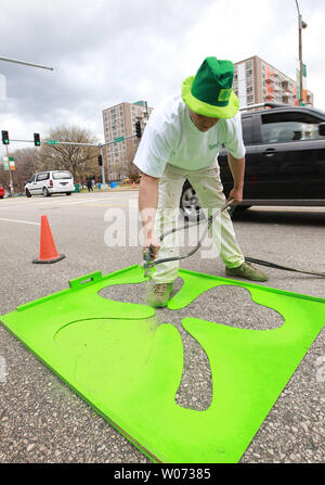 Don Nelson of the St. Louis streets department sprays a four leaf clover onto Market Street as St. Louis prepares for St. Patricks Day on March 16, 2012. St. Louis will host a 5k run and parade that will include over 100 floats on March 17, 2012.    UPI/Bill Greenblatt Stock Photo