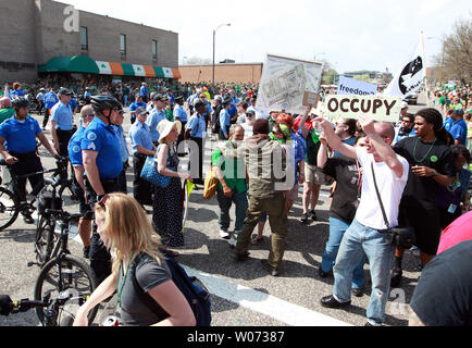 Members of Occupy St. Louis are rerouted by police after trying to gain entry to march in the St. Louis St. Patricks Day Parade in St. Louis on March 17, 2012. Occupy St. Louis has been the home of the Occupy Midwest meetings and rallys this past week. UPI/Bill Greenblatt Stock Photo