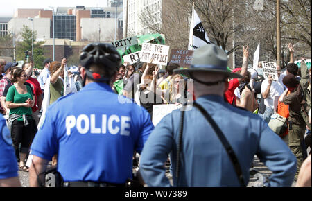 Members of Occupy St. Louis are rerouted by police after trying to gain entry to march in the St. Louis St. Patricks Day Parade in St. Louis on March 17, 2012. Occupy St. Louis has been the home of the Occupy Midwest meetings and rallys this past week. UPI/Bill Greenblatt Stock Photo