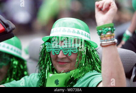 A parade goer enjoys a ride in her float during the St. Louis St. Patricks Day Parade in St. Louis on March 17, 2012. Thousands showed up as temperatures reached the lower 80's. UPI/Bill Greenblatt Stock Photo