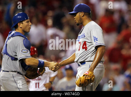 Los Angeles Dodgers pitcher Kenley Jansen (R) is congratulated by catcher A.J. Ellis after the third out and a 5-3 win over the St. Louis Cardinals at Busch Stadium in St. Louis on July 23, 2012.  UPI/Bill Greenblatt Stock Photo