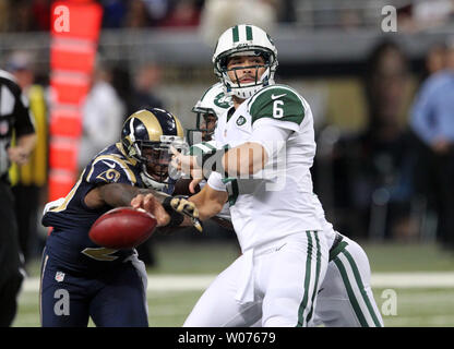 San Francisco, California, USA. 4th Dec, 2011. St. Louis Rams free safety  Quintin Mikell (27) attempts to strip ball from San Francisco 49ers tight  end Vernon Davis (85) on Sunday, December 4