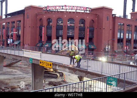 Construction workers use a welding torch to remove railing on the Eighth Street bridge as demolition crews begin to remove the last landmark of the old Busch Stadium in St. Louis on March 9, 2013. Crews are clearing the bridge and surrounding areas for the new Ballpark Village construction project.     UPI/Bill Greenblatt Stock Photo