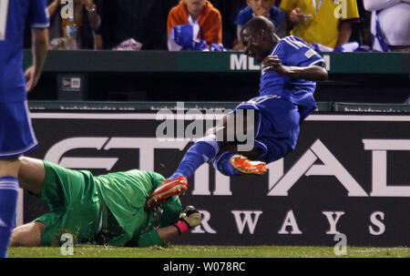 Chelsea's Ramires falls over Manchester City's goalkeeper Joe Hart in the second half of their exhibition game at Busch Stadium in St. Louis on May 23, 2013. Manchester City won the game 4-3.  UPI/Bill Greenblatt Stock Photo