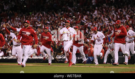 St. Louis Cardinals players charge the mound after defeating the Los Angeles Dodgers 9-0, in Game 6 of the National League Championship Series at Busch Stadium in St. Louis on October 18, 2013. The Cardinals will now advance to the 2013 World Series. UPI/Bill Greenblatt Stock Photo