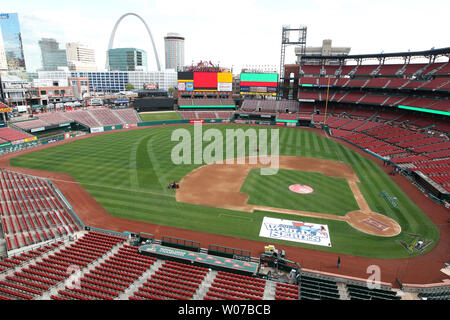 Painters from Warren Sign Company prepare new stcikers on the left field  wall of retired numbers for opening day at Busch Stadium in St. Louis in  April 5, 2013. The St. Louis