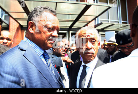 Rev. Jessie Jackson and Rev. Al Sharpton talk with friends at the completion of the funeral for Michael Brown in St. Louis on August 25, 2014. Brown gained attention after being shot by a white Ferguson, Missouri police officer on August 9 and was unarmed. The shooting led to several nights of looting, arrests and heavy police presence.   UPI/Bill Greenblatt Stock Photo