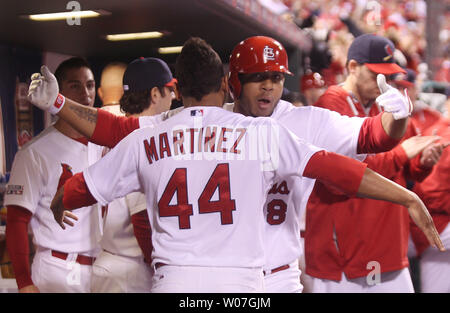 St. Louis Cardinals outfielder Oscar Taveras enters the clubhouse