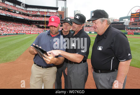 Major league umpires wear wristbands to protest 'escalating verbal