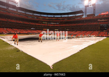 TarpGuy gets pulled under when grounds crew rolls field cover at Royals game