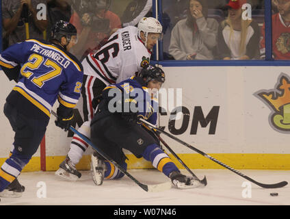 The Chicago Blackhawks' Marcus Kruger (16) Is Pushed Down In Front Of 