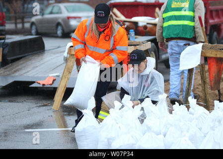 Volunteers fill sandbags as three days of steady rains have caused the Meramec River to rise to near record levels in Eureka, Missouri on December 28, 2015. Missouri Governor Jay Nixon has declared a state of emergency with over 125 roads flooded or closed and 10 deaths due to the flooding statewide. Photo by Bill Greenblatt/UPI Stock Photo