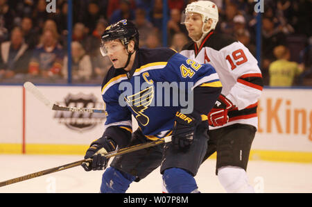 St. Louis Blues David Backes waits for the pass in front of  New Jersey Devils Travis Zajac in the first period at the Scottrade Center in St. Louis on January 12, 2016. St. Louis defeated New Jersey 5-2.   Photo by Bill Greenblatt/UPI Stock Photo