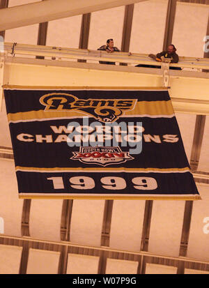 As work on overhead lighting takes place on the floor of the Edward Jones  Dome in St. Louis, The St. Louis Rams Super Bowl Championship banner  continues to hang from the rafters