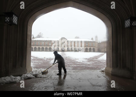 Washington University employee Dorrel Critten shovels snow near Brookings Hall in St. Louis on February 24, 2015. An early morning snow storm dropped nearly four inches of heavy, wet snow on the area. Photo by Bill Greenblatt/UPI Stock Photo