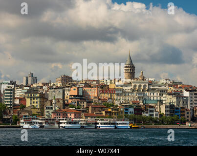 Beyoglu district old houses with Galata tower on top, view from the Golden Horn. June 26, 2019, Istanbul, Turkey Stock Photo